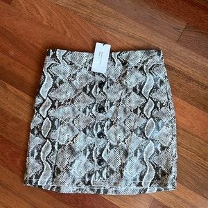 Snake print faux leather skirt